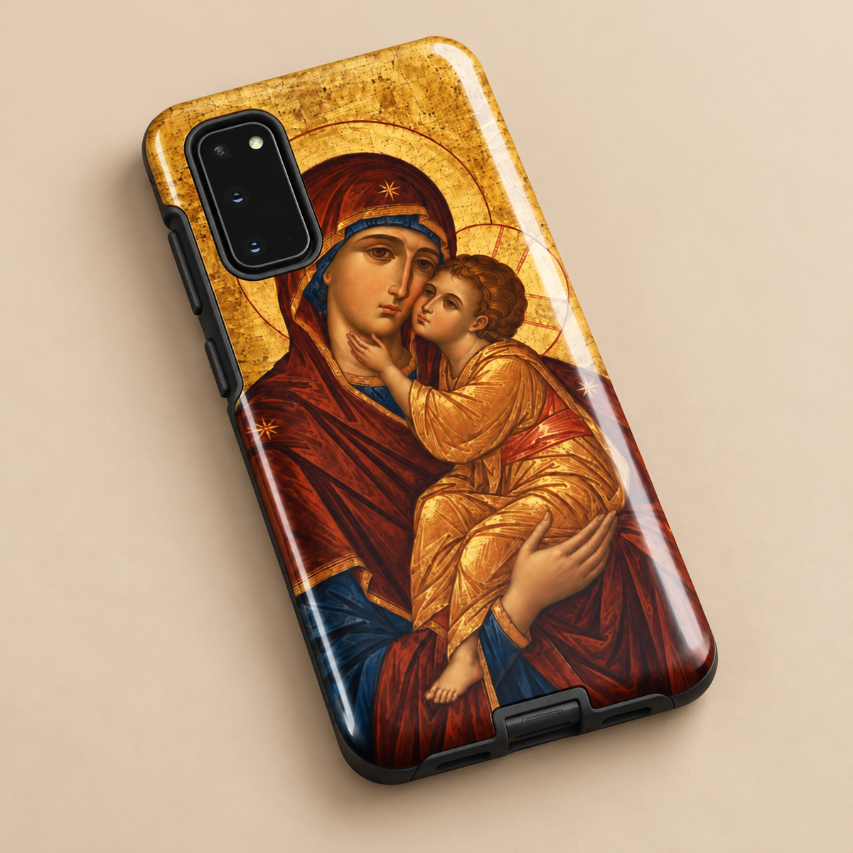Theotokos icon Samsung Galaxy tough case on a wooden table beside coffee and a leather Bible